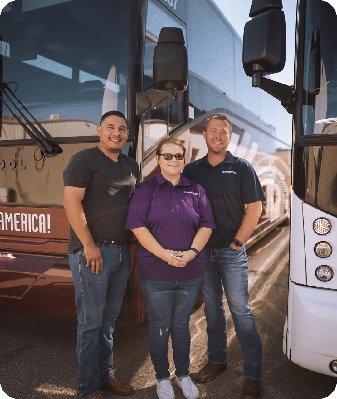 The All Aboard America team of drivers mechanics and staff pose together in front of a Prevost motorcoach