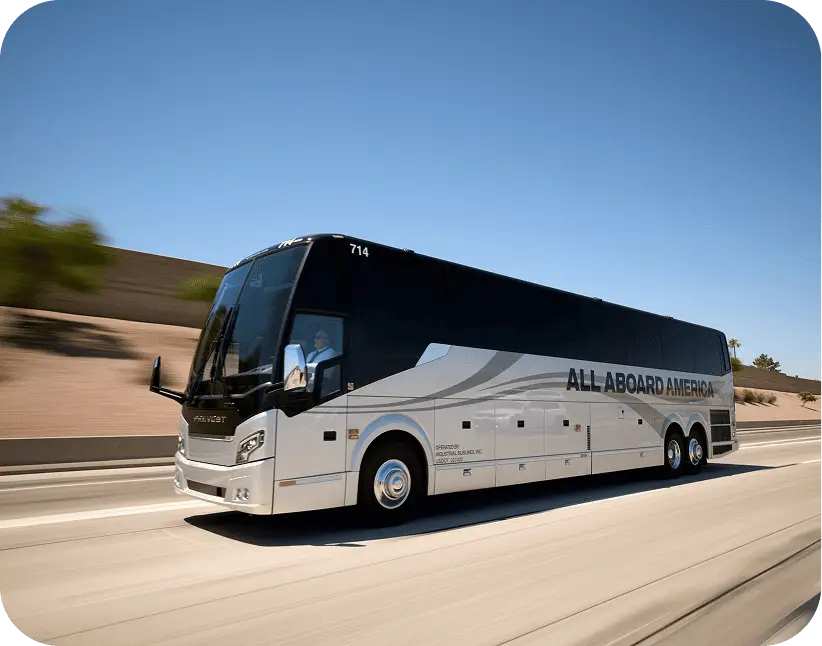 An All Aboard America Prevost motorcoach number 714 cruises along a highway for over-the-road charter trips