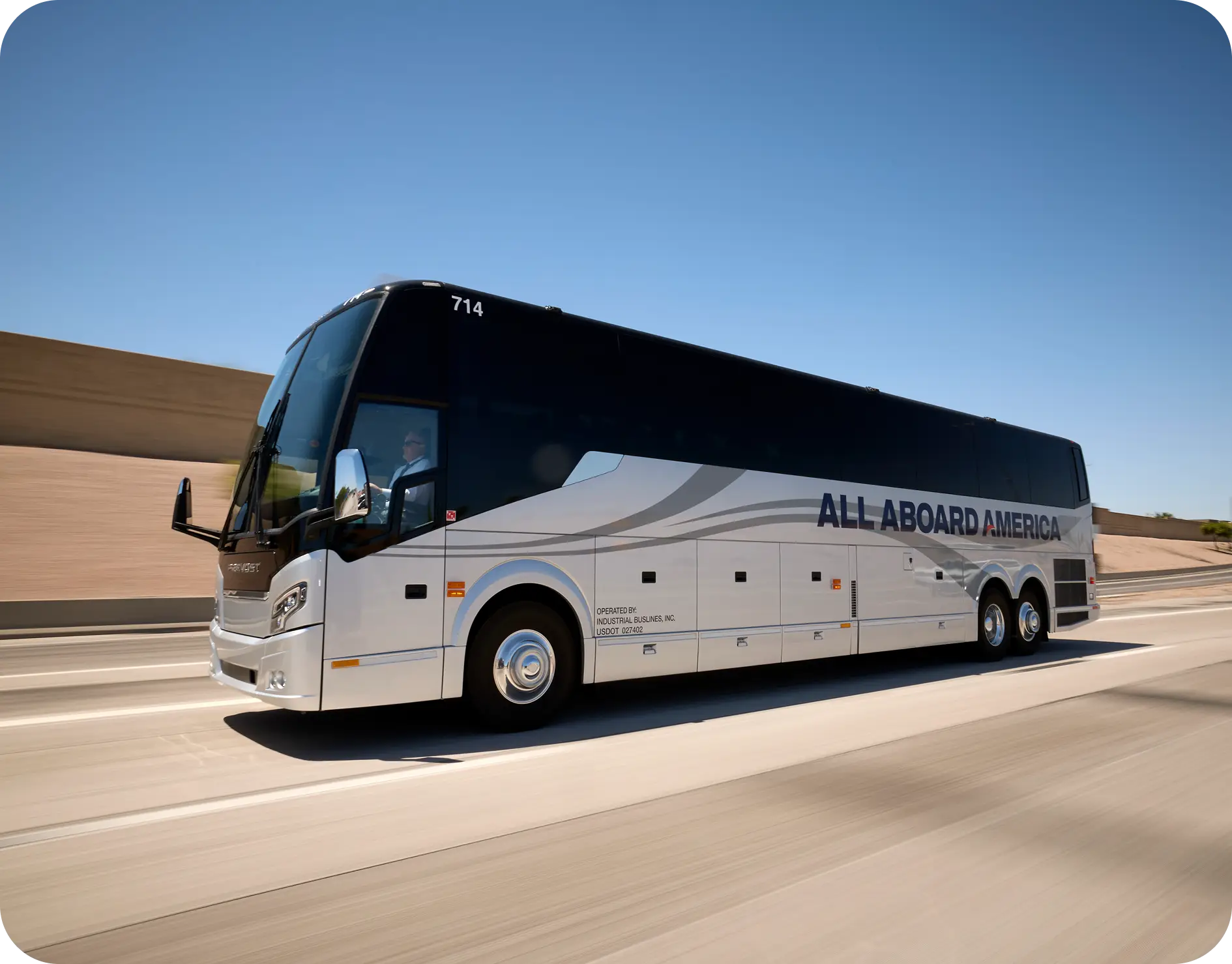 All Aboard America Prevost motorcoach number 714 traveling at highway speed on a clear day