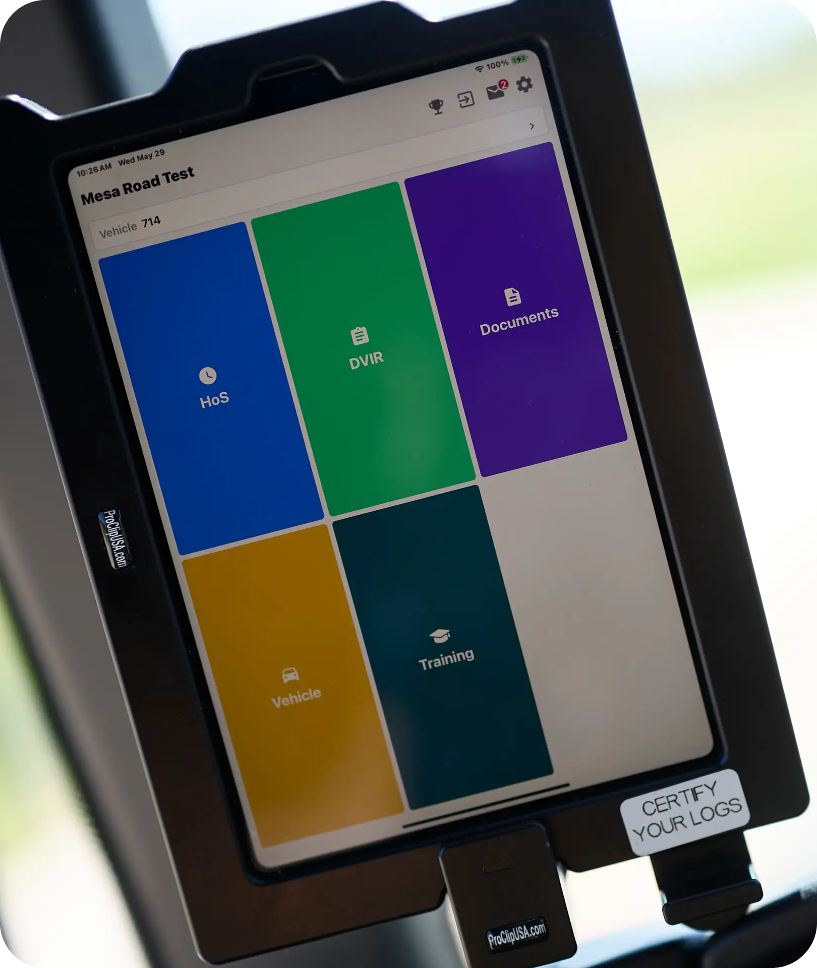 An All Aboard America fleet management tablet mounted in a bus showing driver compliance and training tools